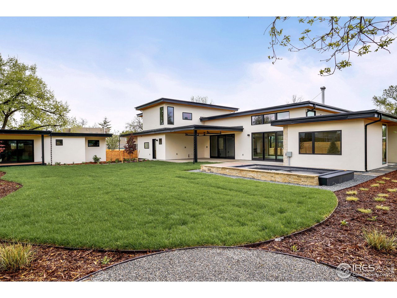2125 Upland Avenue Boulder, CO 80304 - Photo 28 of 36 a front view of a house with a garden