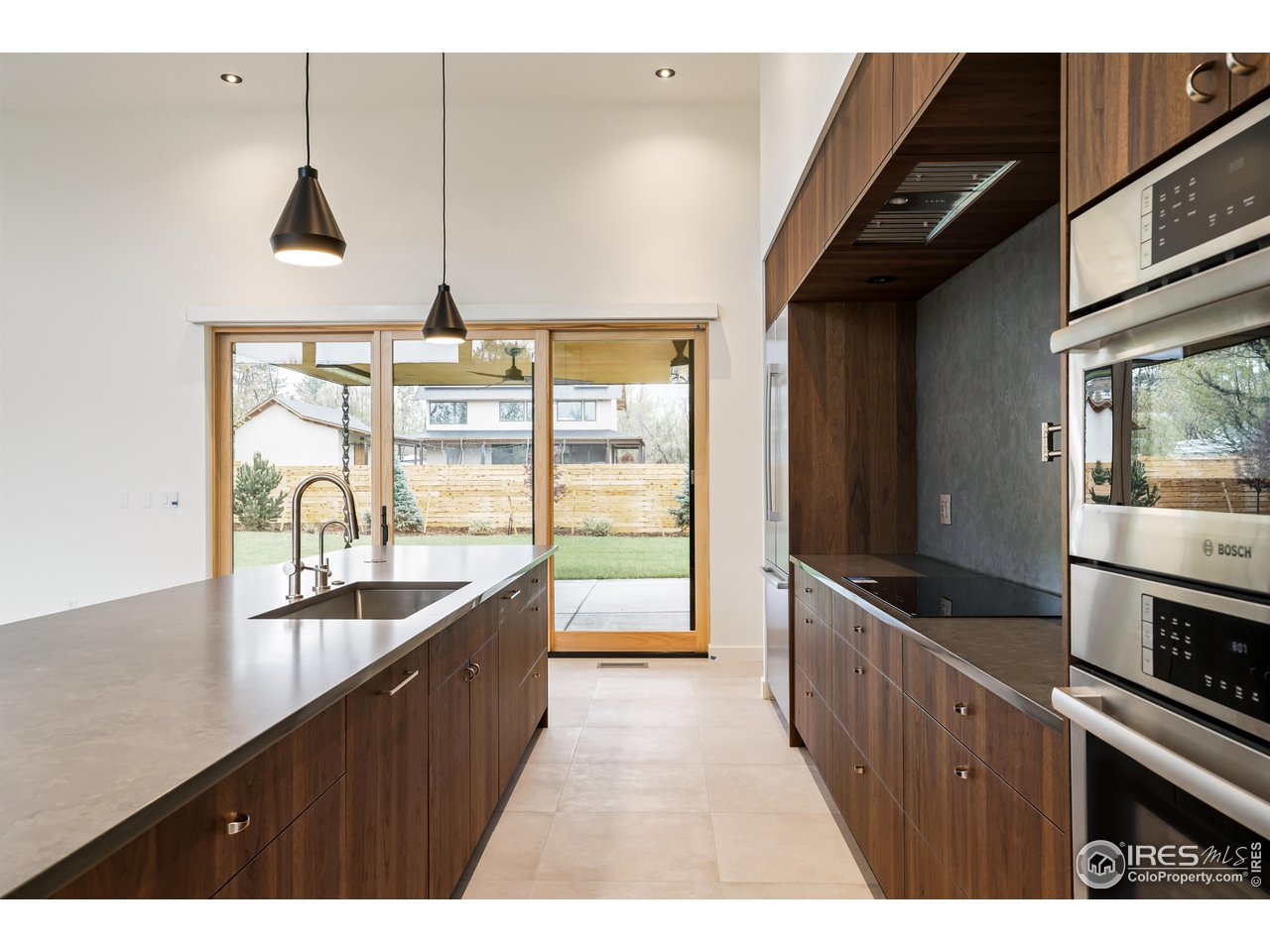 2125 Upland Avenue Boulder, CO 80304 - Photo 7 of 36 a kitchen with counter top space a sink and wooden floor