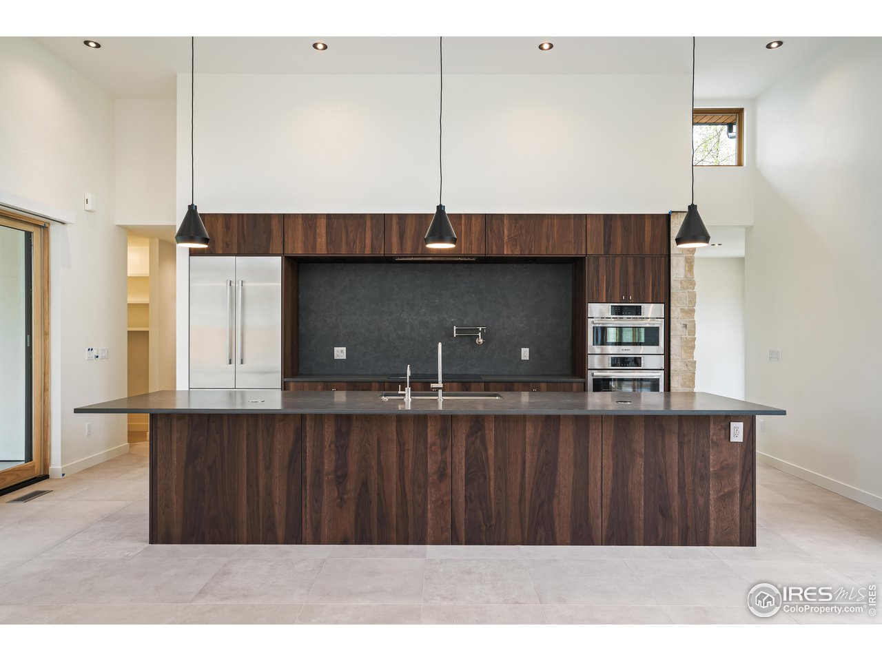 2125 Upland Avenue Boulder, CO 80304 - Photo 8 of 36 a kitchen with stainless steel appliances a sink dishwasher a refrigerator and wooden cabinets