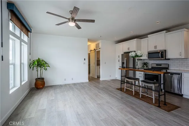 a workspace with furniture window and wooden floor
