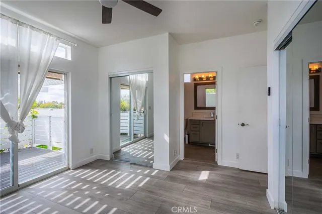 a view of an entryway with wooden floor and door