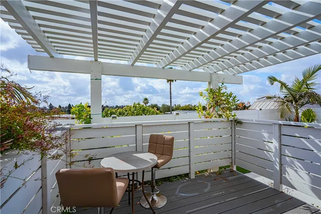 a view of a chairs and table in a patio