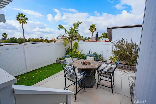 a view of a backyard with a sitting area