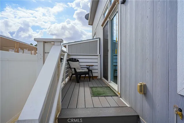 a balcony with view of outdoor space