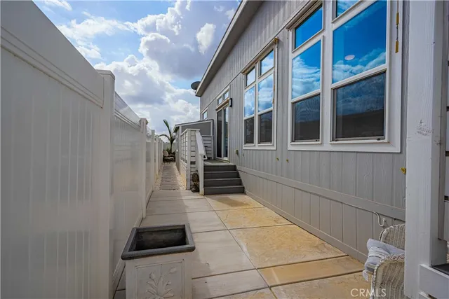 a view of a brick house with a large window