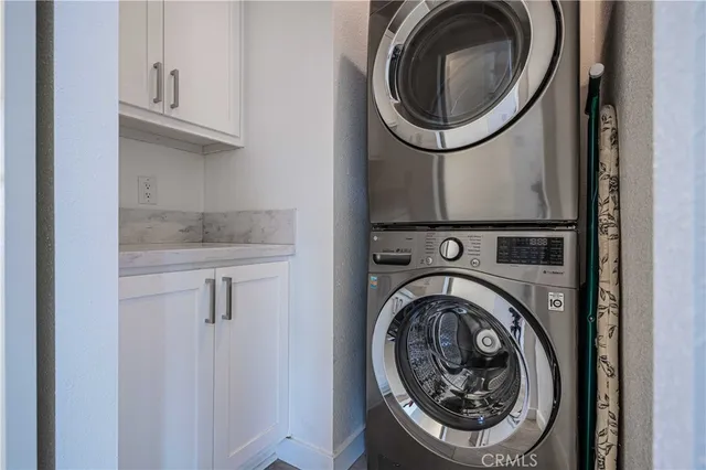 a view of house with swimming pool and furniture