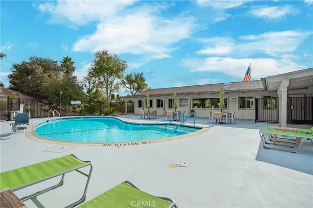 a view of a swimming pool with a lounge chairs