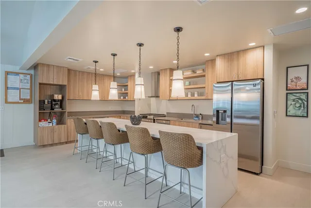a view of a dining room with furniture wooden floor and chandelier