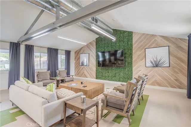 a room with gym equipment and a view of living room