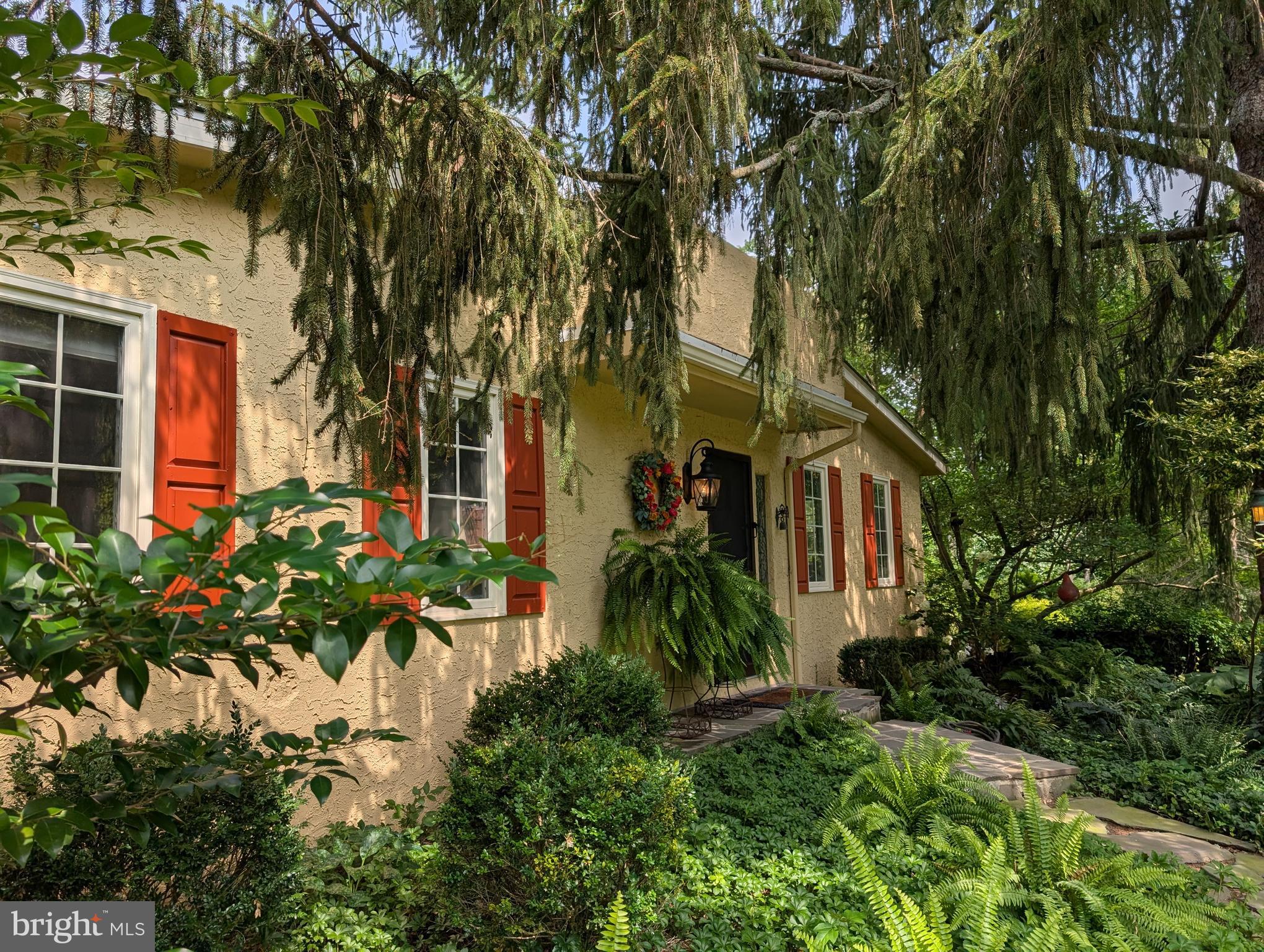 an outdoor view of house with garden