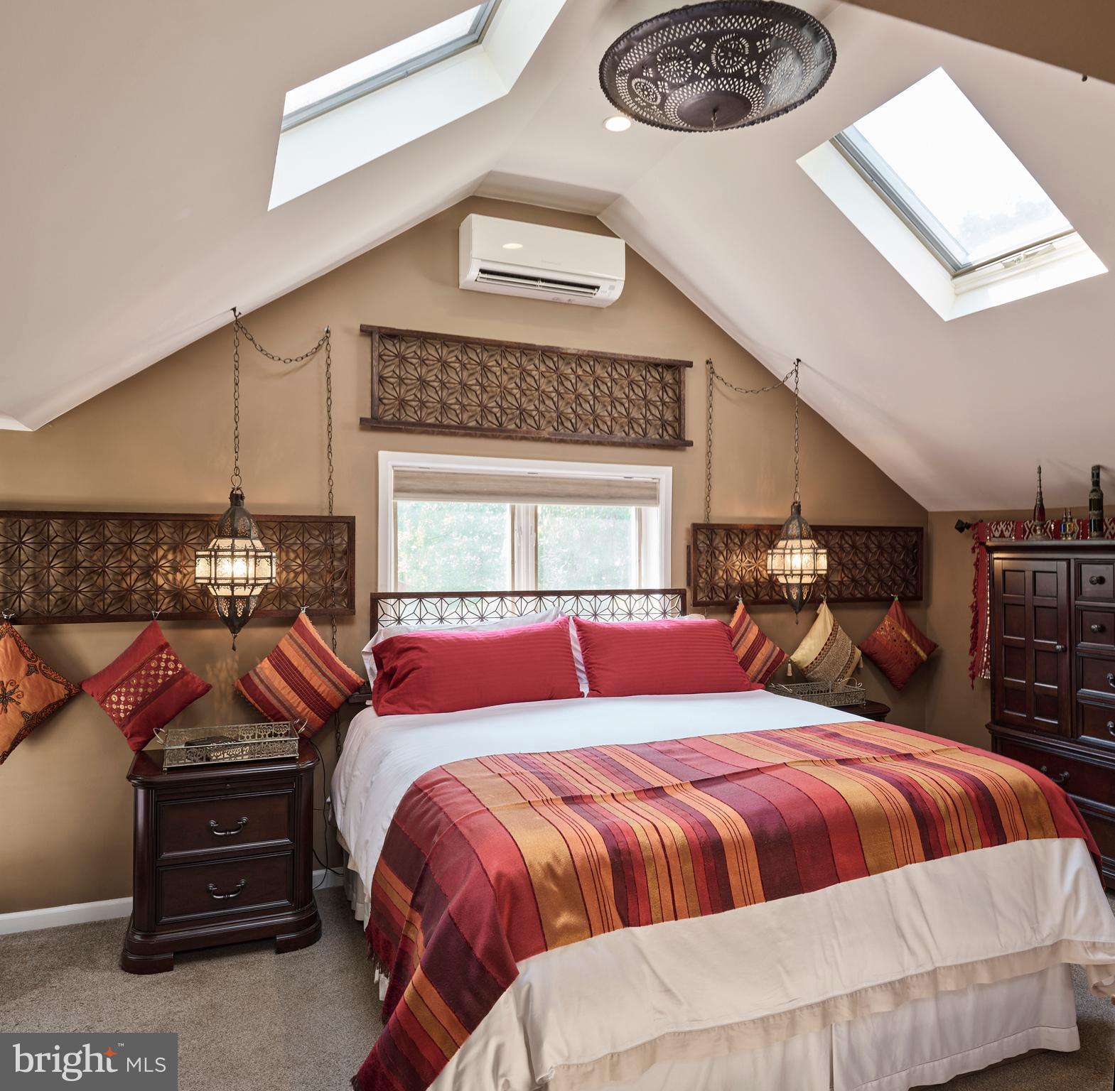 2125 Old Woods Road Green Lane, PA 18054 - Photo 34 of 53 a bed sitting in a bedroom next to a lamp