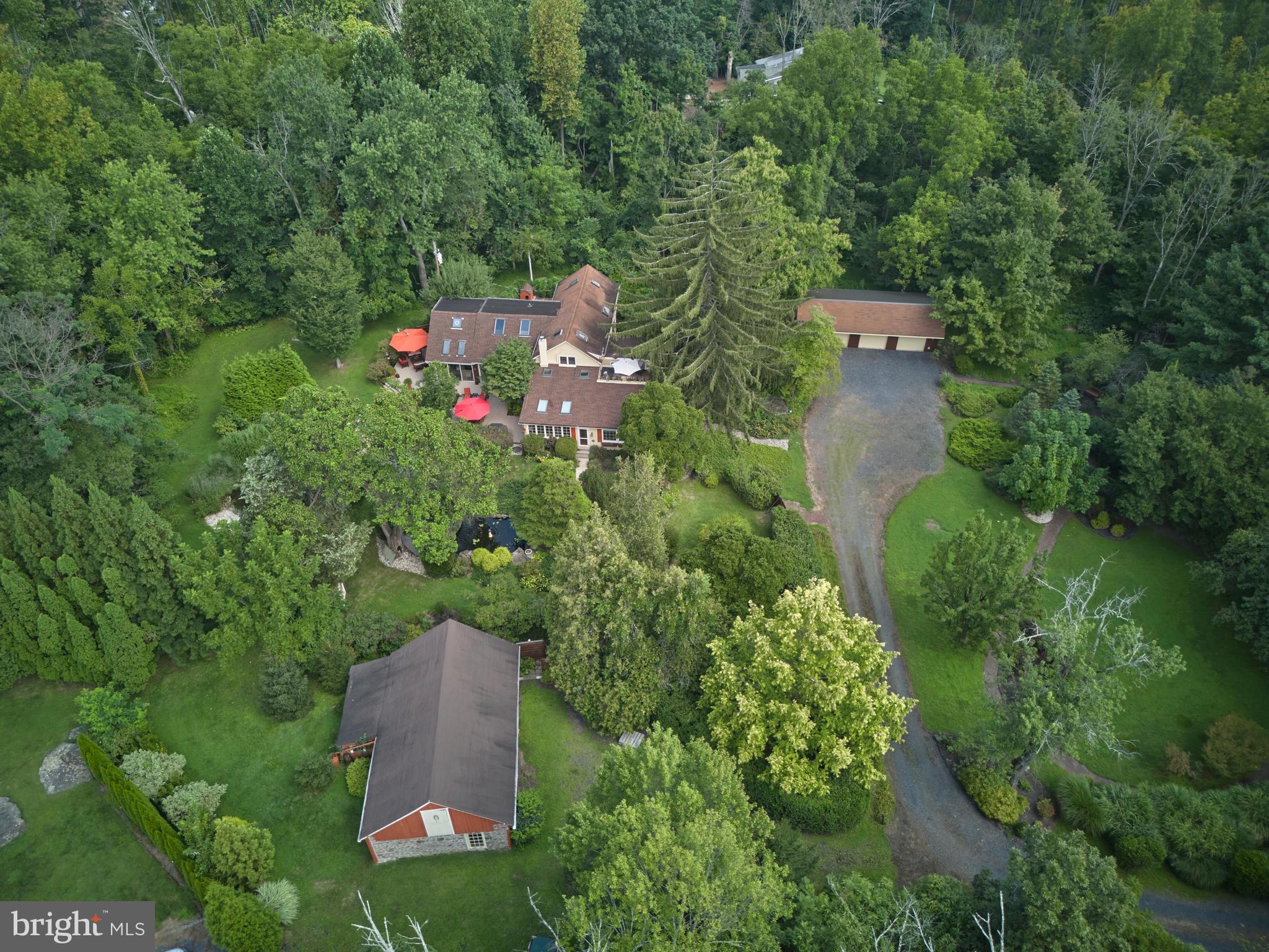 2125 Old Woods Road Green Lane, PA 18054 - Photo 45 of 53 an aerial view of a house with a yard and trees