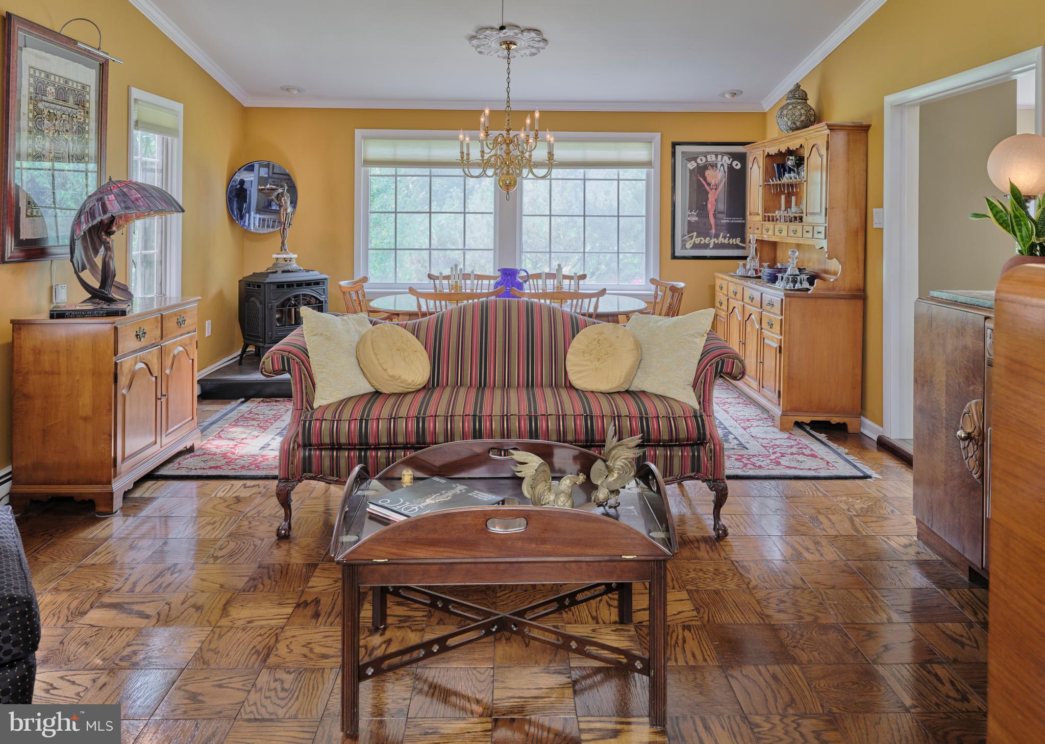2125 Old Woods Road Green Lane, PA 18054 - Photo 9 of 53 a dinning area with furniture a rug and a chandelier