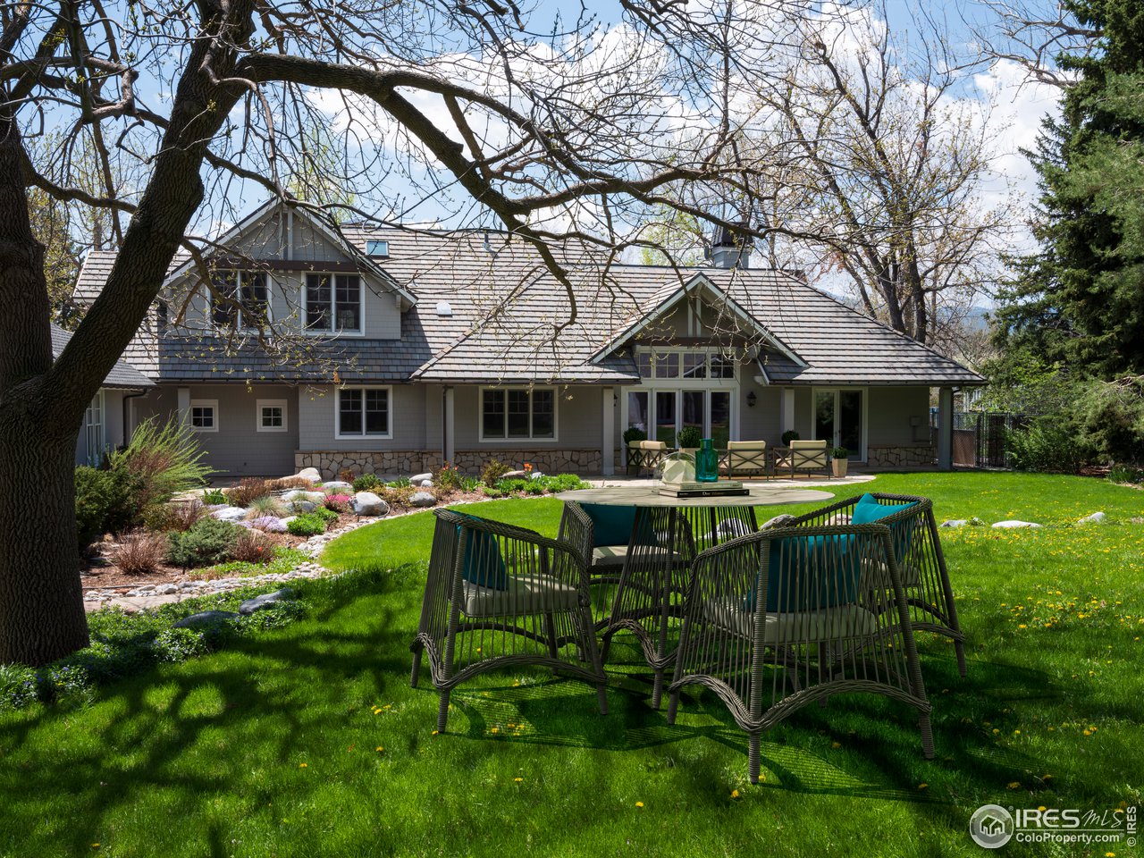 2205 Topaz Drive Boulder, CO 80304 - Photo 11 of 33 a backyard of a house with table and chairs
