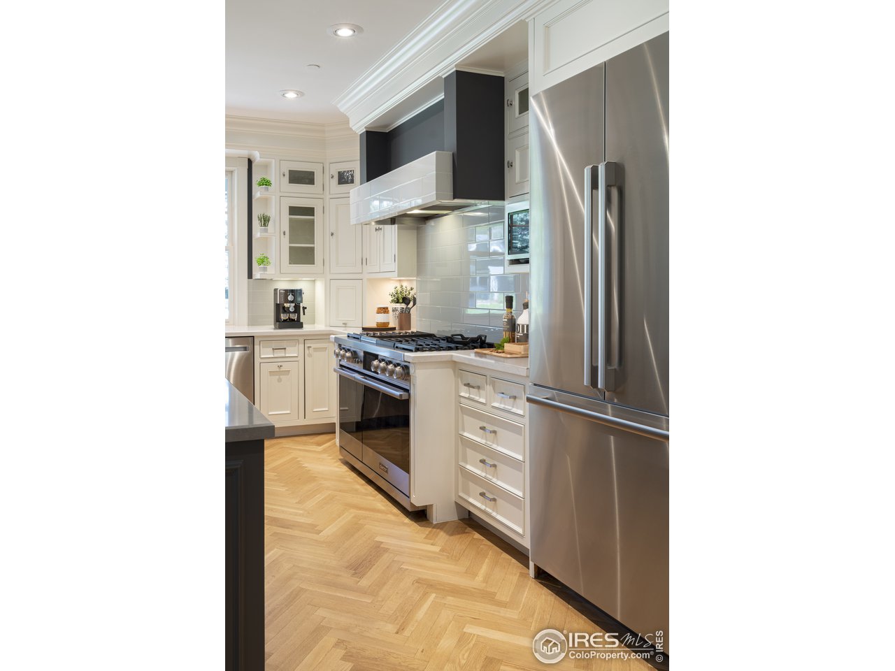 2205 Topaz Drive Boulder, CO 80304 - Photo 13 of 33 a kitchen with stainless steel appliances a refrigerator and a stove