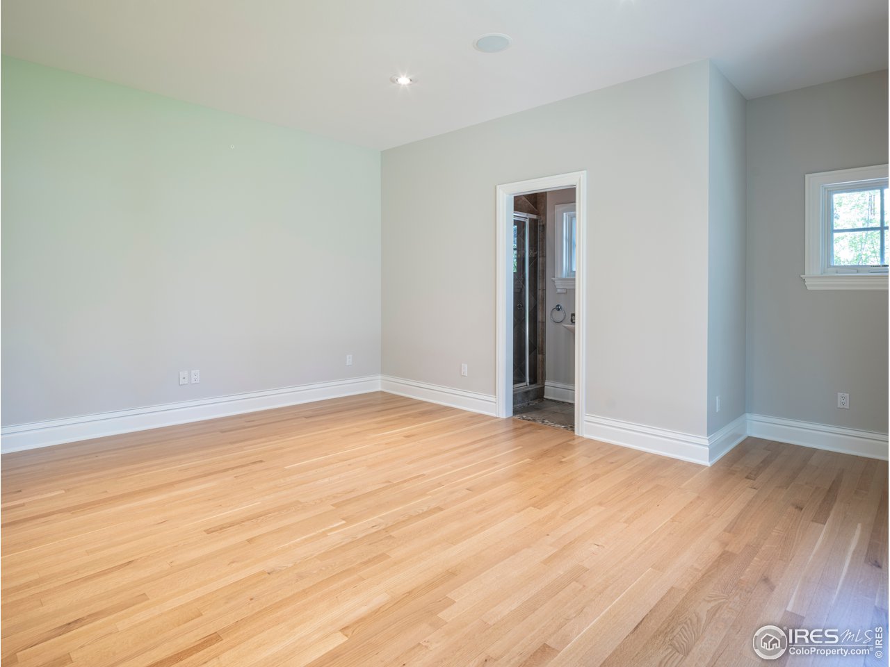 2205 Topaz Drive Boulder, CO 80304 - Photo 24 of 33 a view of an empty room with wooden floor and closet