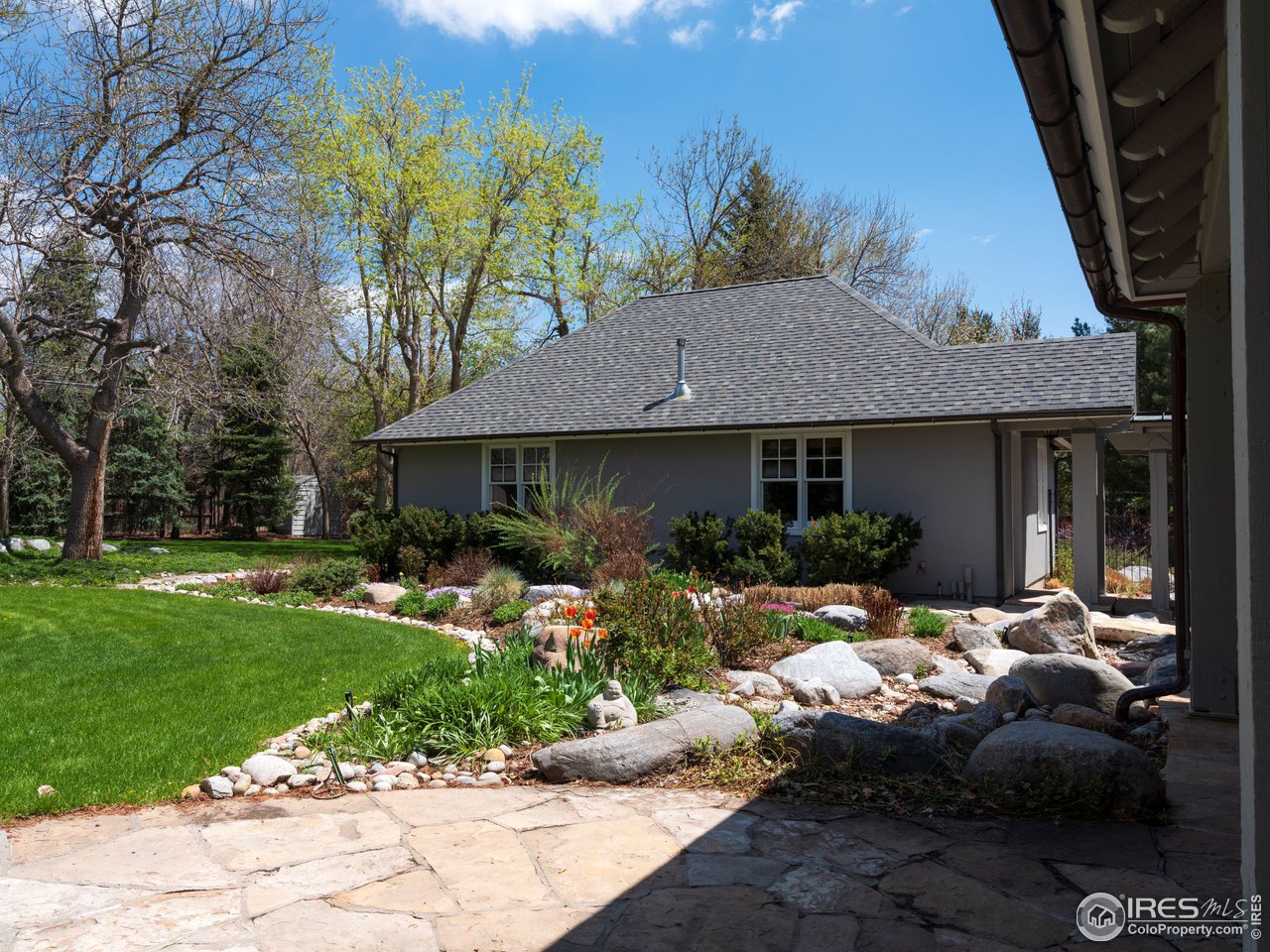 2205 Topaz Drive Boulder, CO 80304 - Photo 32 of 33 a front view of a house with a yard outdoor seating and green space