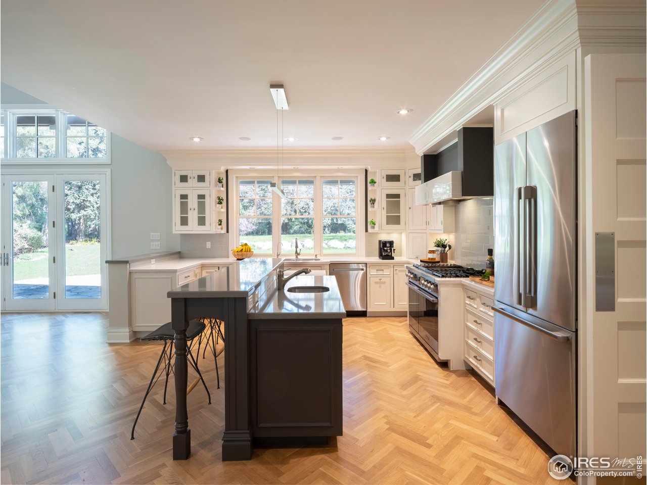 2205 Topaz Drive Boulder, CO 80304 - Photo 10 of 33 a large kitchen with stainless steel appliances kitchen island granite countertop a large window and a refrigerator