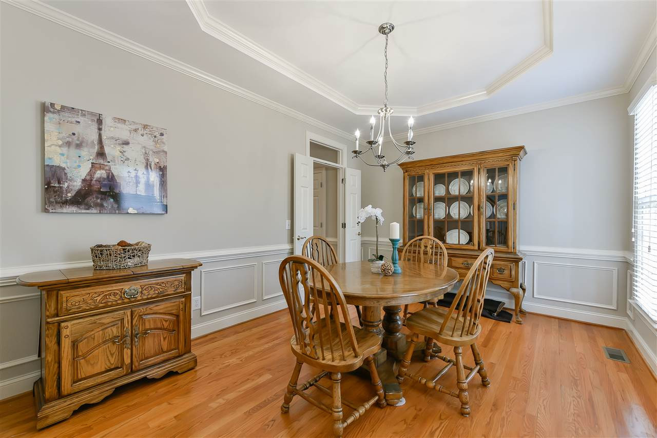 6017 Glenthorne Drive Raleigh, NC 27613 - Photo 4 of 13 Elegant Formal Dining Room with HARDWOOD floors, TREY ceiling, and wainscoting. Dining Room