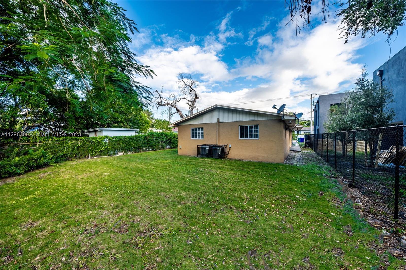 Buena Vista Miami, FL 33127 - Photo 4 of 15 a view of a backyard with plants and large tree