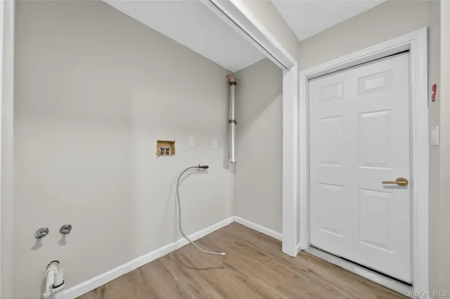 a view of backyard with a garden and deck