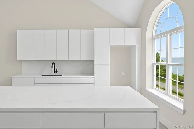 a bathroom with a bathtub and a window