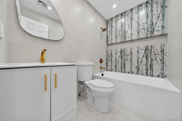 a bathroom with a sink a mirror and a toilet