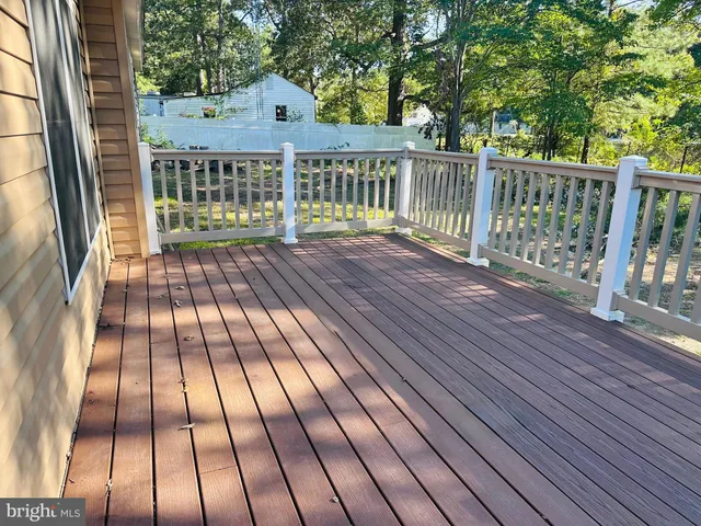 a view of balcony with wooden floor