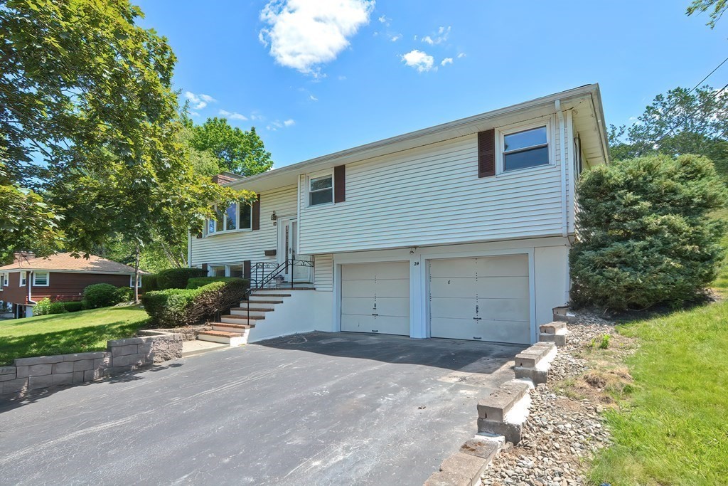 24 Cherry Road Framingham, MA 01701 - Photo 1 of 30 a front view of a house with garden