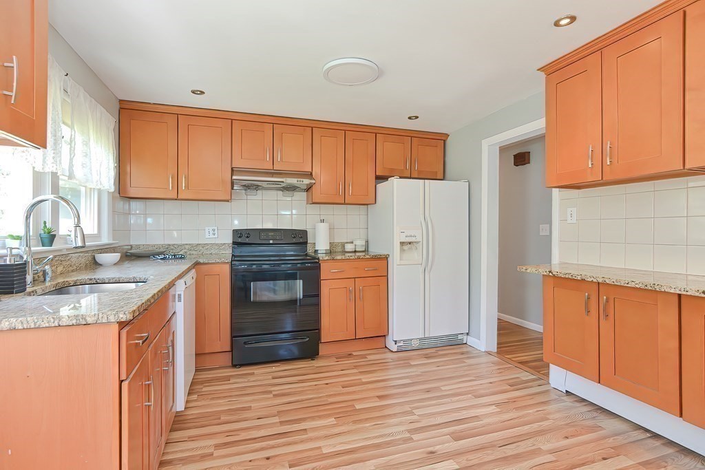 24 Cherry Road Framingham, MA 01701 - Photo 13 of 30 a kitchen with stainless steel appliances granite countertop a refrigerator sink and cabinets