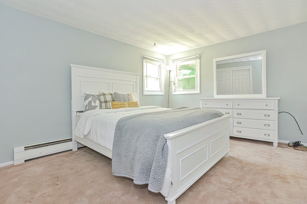24 Cherry Road Framingham, MA 01701 - Photo 17 of 30 a bedroom with a bed and a dresser