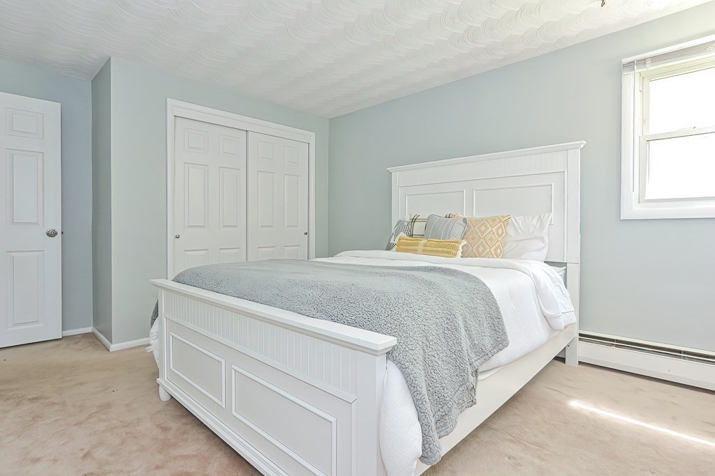 24 Cherry Road Framingham, MA 01701 - Photo 18 of 30 a bedroom with a bed and window