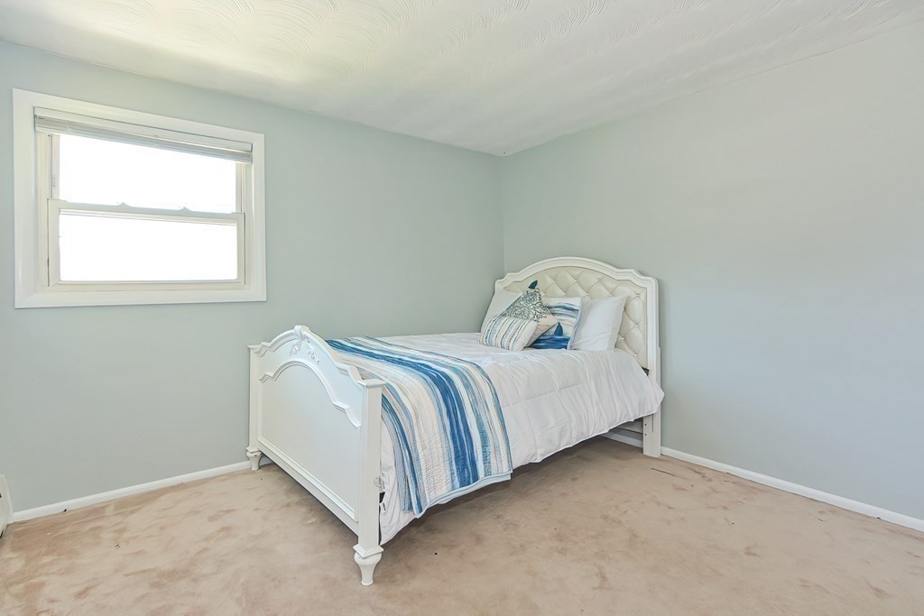 24 Cherry Road Framingham, MA 01701 - Photo 20 of 30 a bedroom with a bed and a window