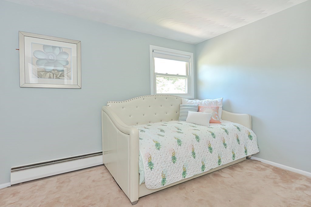 24 Cherry Road Framingham, MA 01701 - Photo 21 of 30 a spacious bedroom with a bed and a window