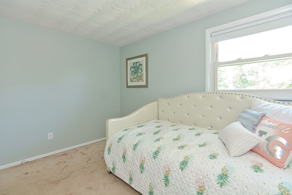 24 Cherry Road Framingham, MA 01701 - Photo 22 of 30 a bedroom with a bed and a window