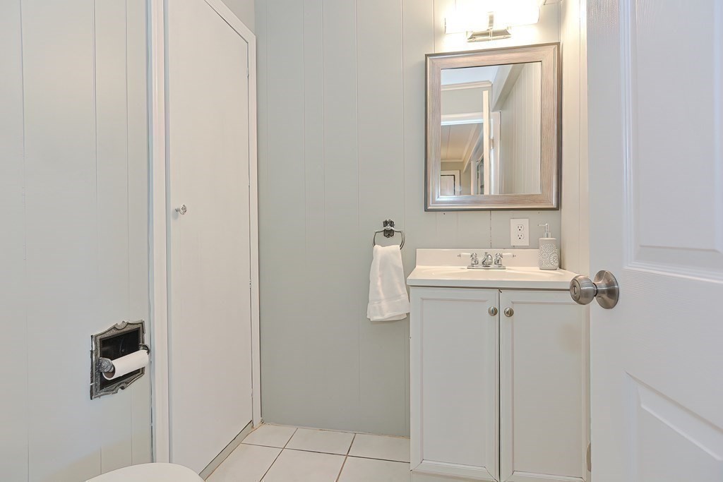 24 Cherry Road Framingham, MA 01701 - Photo 24 of 30 a bathroom with a sink vanity and a mirror