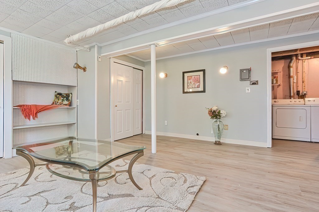 24 Cherry Road Framingham, MA 01701 - Photo 27 of 30 a view of a livingroom with furniture and wooden floor