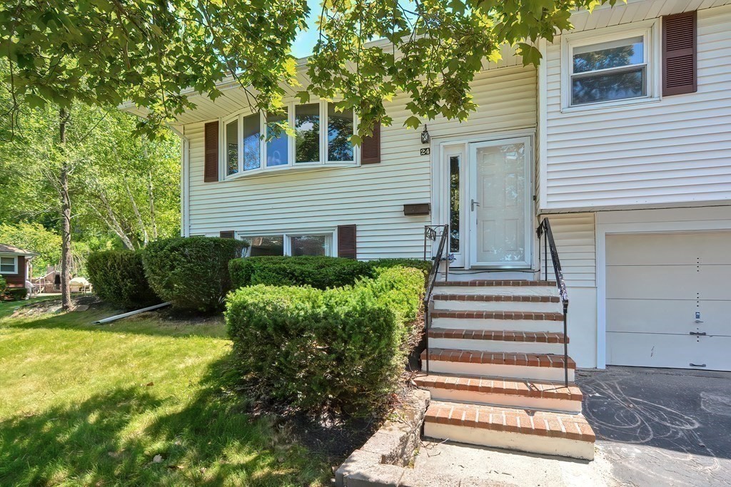 24 Cherry Road Framingham, MA 01701 - Photo 30 of 30 a front view of a house with garden