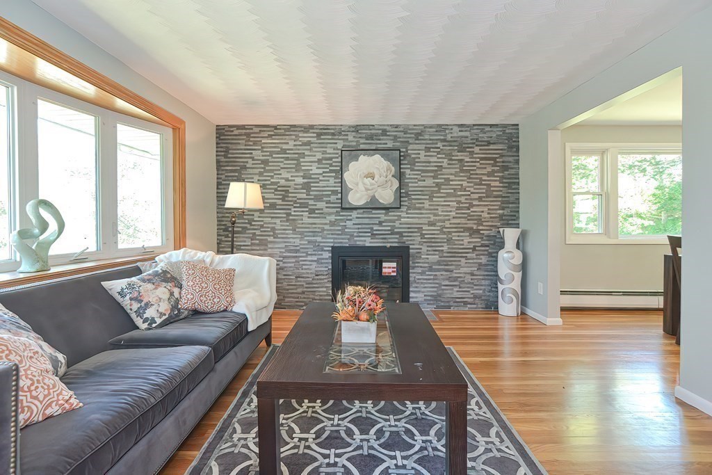 24 Cherry Road Framingham, MA 01701 - Photo 3 of 30 a living room with furniture and a fireplace