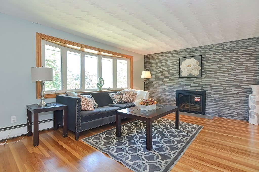 24 Cherry Road Framingham, MA 01701 - Photo 5 of 30 a living room with furniture and a fireplace