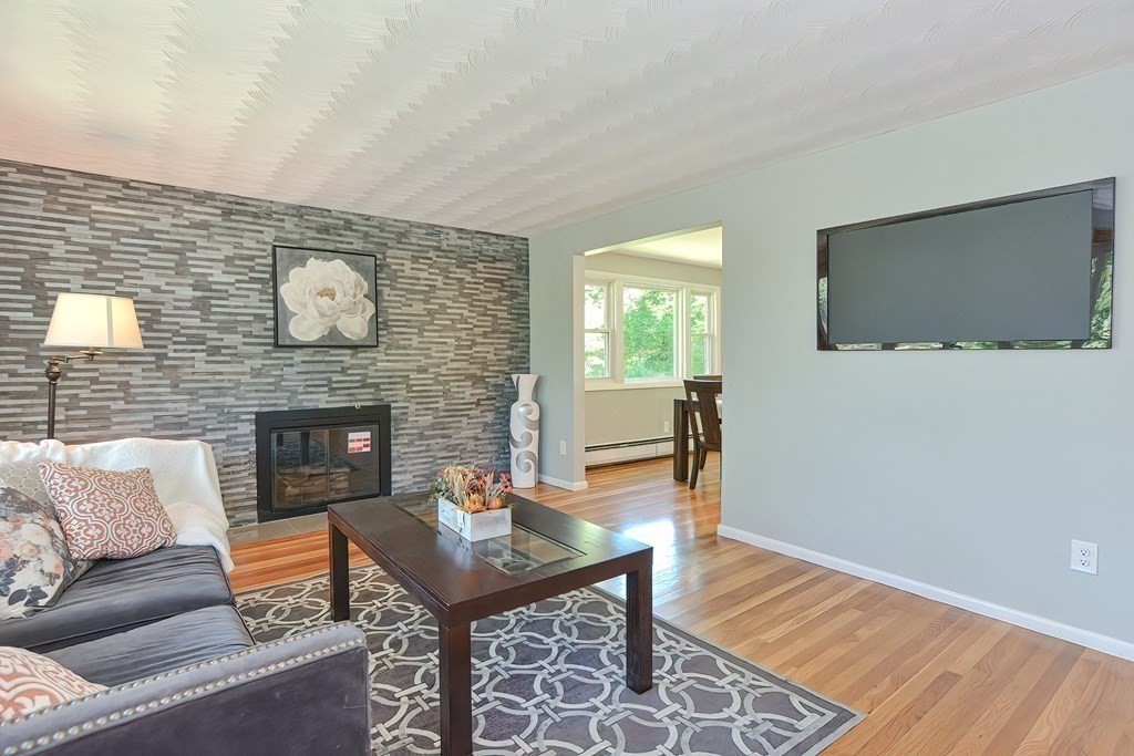 24 Cherry Road Framingham, MA 01701 - Photo 6 of 30 a living room with furniture and a flat screen tv