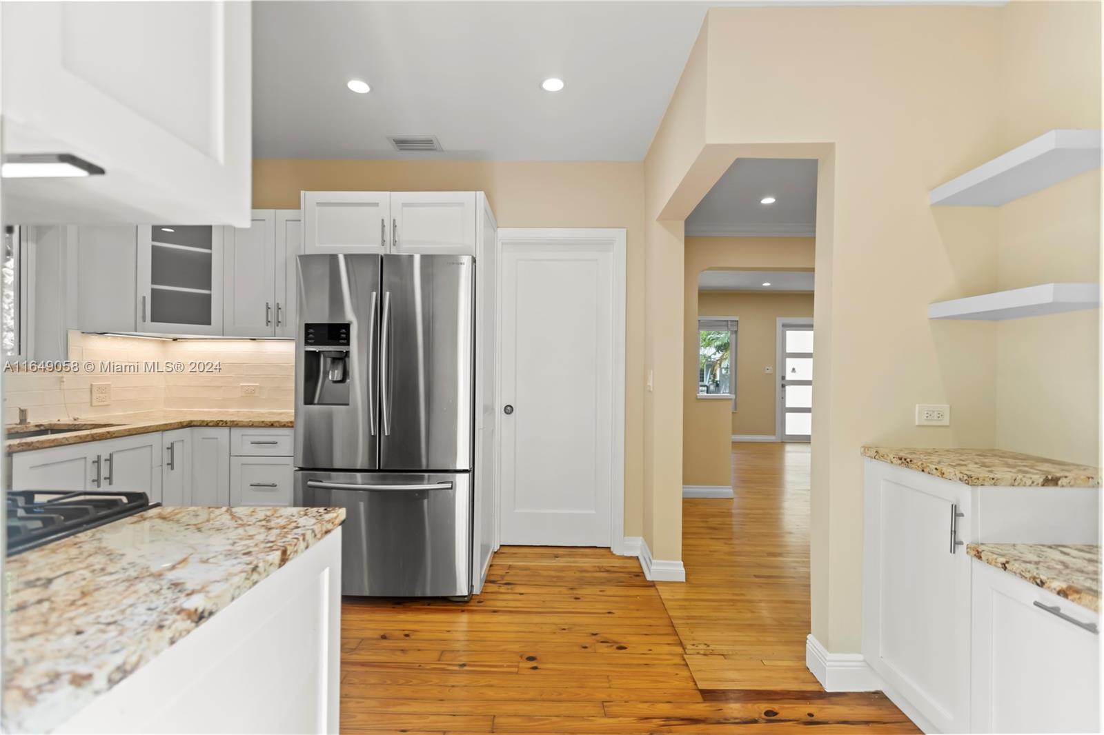 610 Southwest 25th Road Miami, FL 33129 - Photo 16 of 46 a kitchen with a refrigerator and a sink