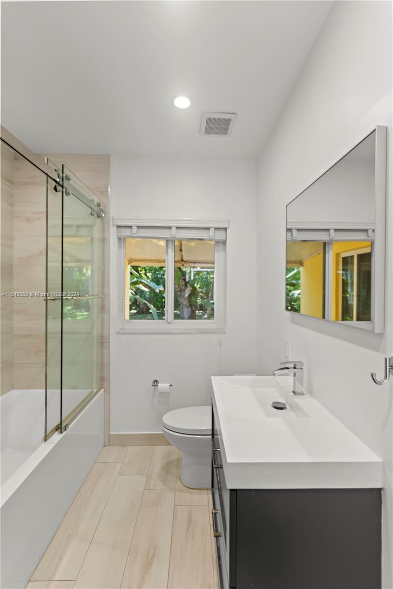 610 Southwest 25th Road Miami, FL 33129 - Photo 33 of 46 a bathroom with a sink a toilet and shower