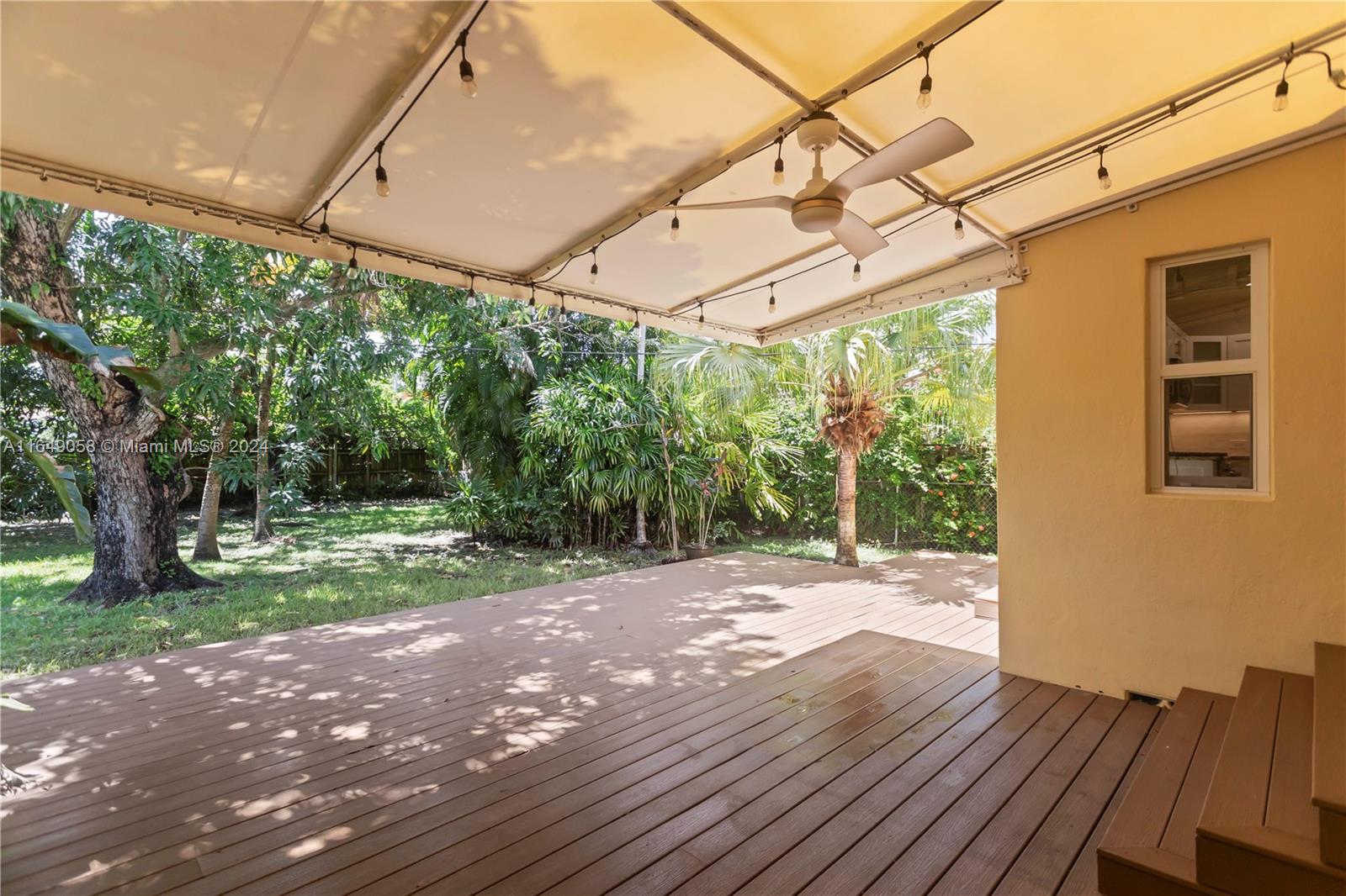 610 Southwest 25th Road Miami, FL 33129 - Photo 41 of 46 a view of a backyard with wooden floor and iron fence