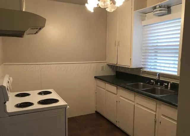 a bathroom with a sink and a washing machine