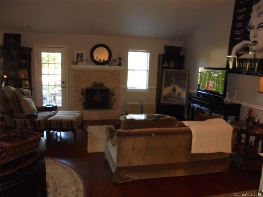 1037 Ridgefield Circle Indian Trail, NC 28079 - Photo 18 of 19 a living room with furniture and a fireplace