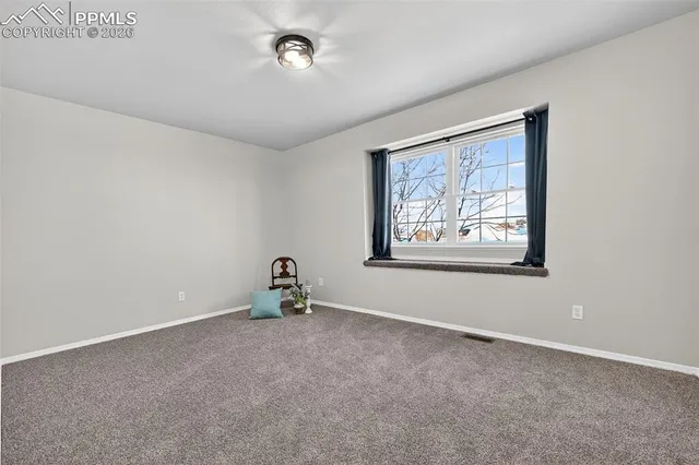 a living room with furniture a rug and a fireplace