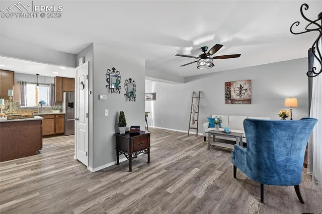 a living room with furniture and a table