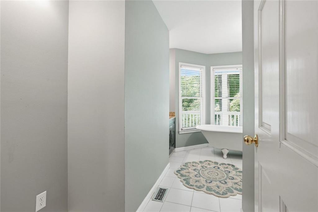 3259 Etchison Road Loganville, GA 30052 - Photo 20 of 50 a bedroom with a bed and window