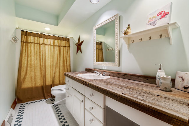 8N261 Thomas Road Maple Park, IL 60151 - Photo 22 of 36 a bathroom with a granite countertop sink and a mirror